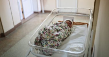 The one-day-old baby of Lida, 22, is pictured at a maternity hospital after a bomb hit a psychiatric hospital nearby, as Russia&#039;s invasion of Ukraine continues, in Mykolaiv, Ukraine March 22, 2022. (Reuters Photo)