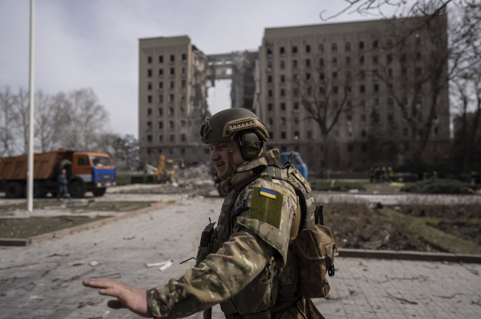 A Ukrainian soldier secures the area next to the regional government headquarters of Mykolaiv, Ukraine, March 29, 2022. (AP Photo)