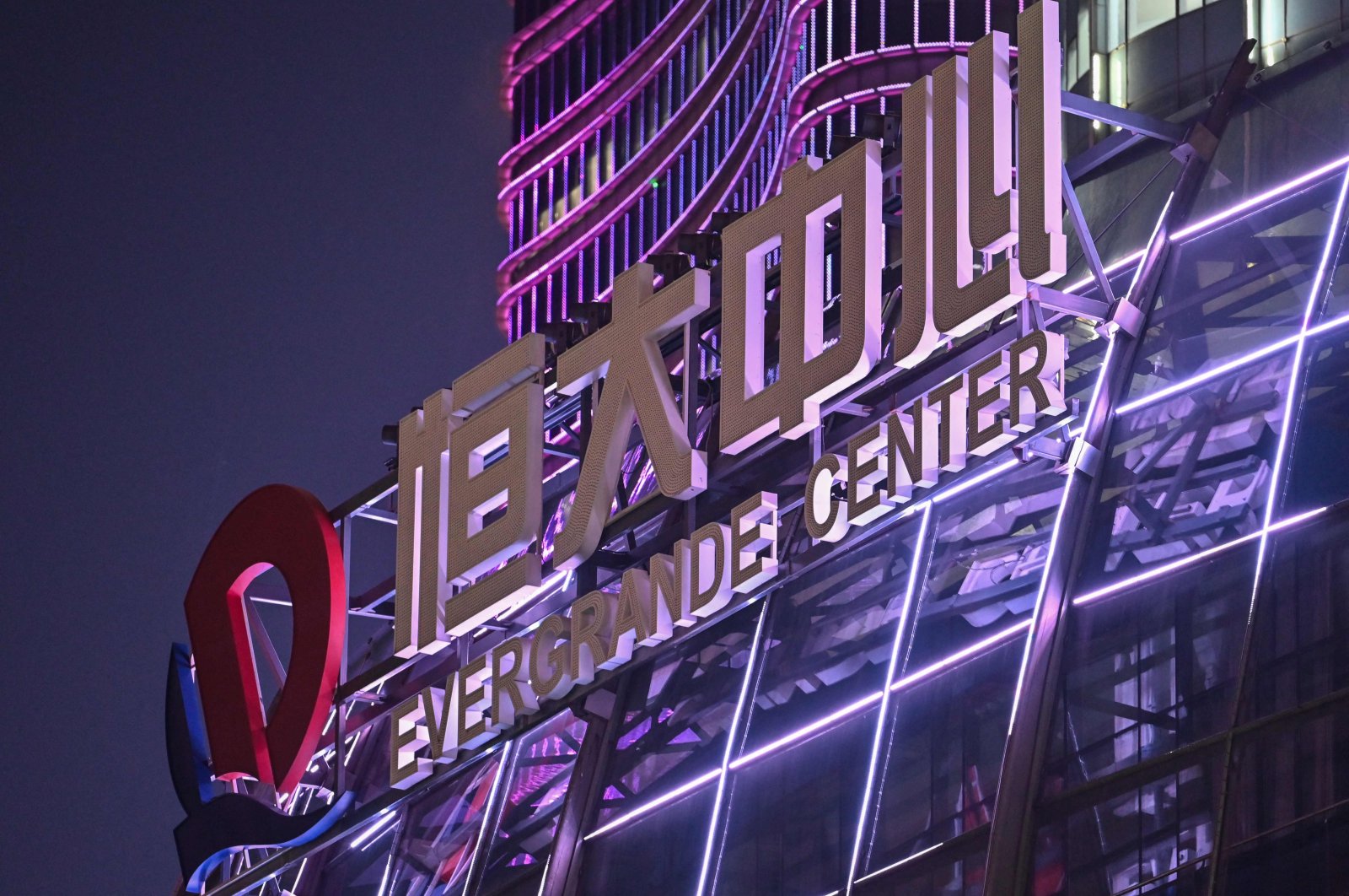 A sign of the Evergrande Center is seen at the Evergrande building in Shanghai, China, Oct. 9, 2021. (AFP Photo)