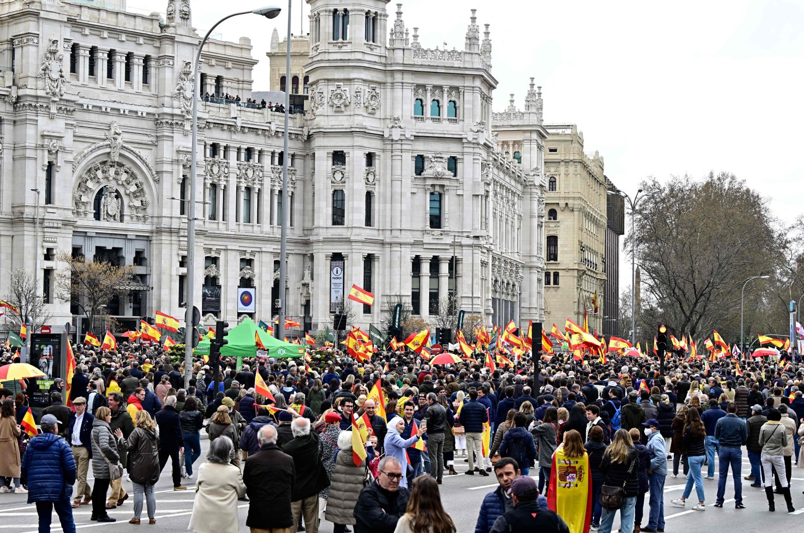 Demonstrators wave Spanish flags during a nationwide protest called by Spanish far-right Vox party against price hikes, in front of the city hall in Madrid, Spain, March 19, 2022. (AFP Photo)