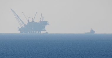 An Israeli navy boat is seen next to the production platform of the Leviathan natural gas field in the Mediterranean Sea near Kibbutz Nahsholim in northern Israel, Dec. 18, 2019. (Reuters Photo)