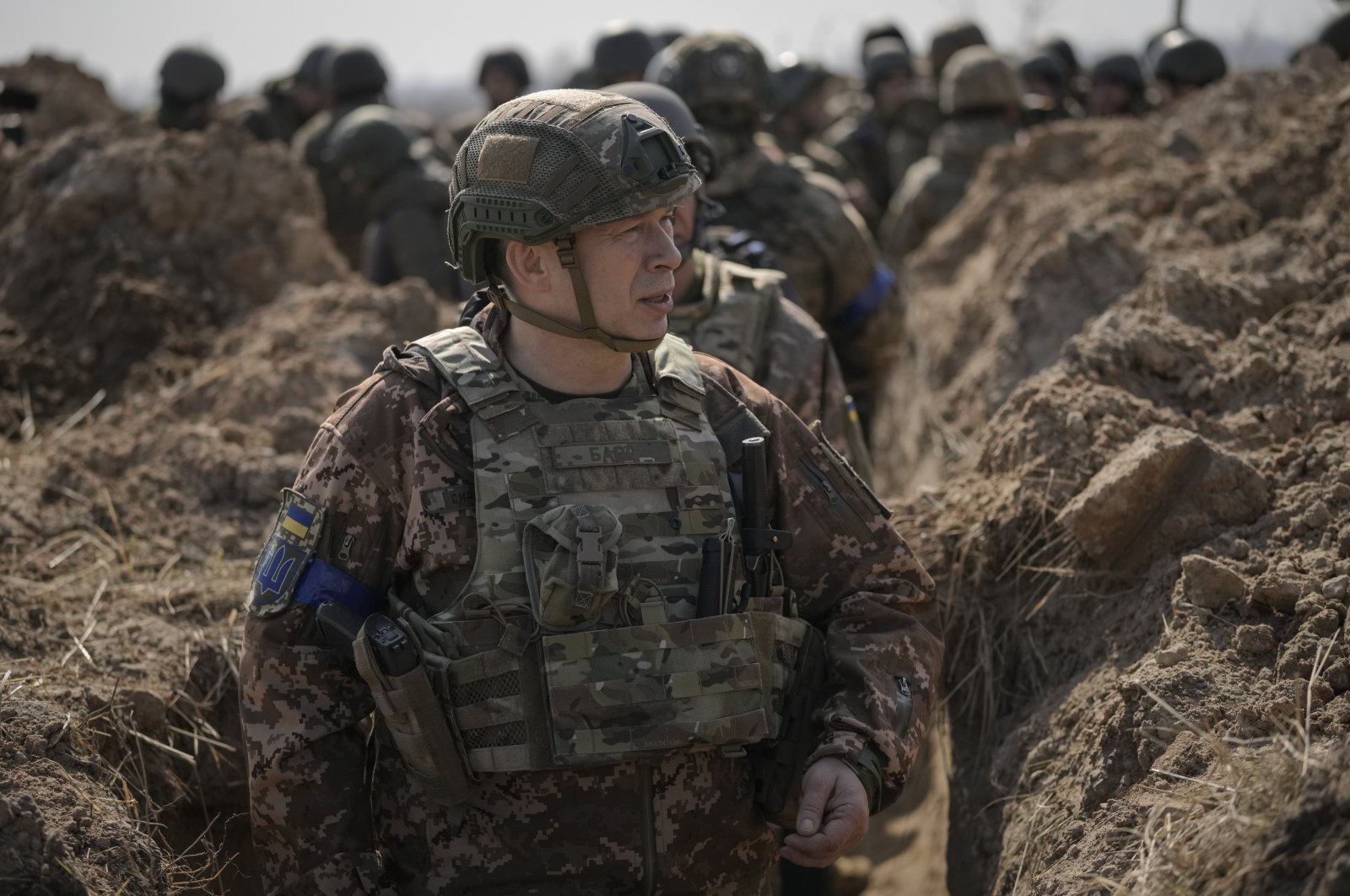 Col. Gen. Oleksandr Syrskyi, the top military commander in charge of the defense of the Ukrainian capital, walks in a trench at a position north of the capital Kyiv, Ukraine, Tuesday, March 29, 2022. (AP Photo)