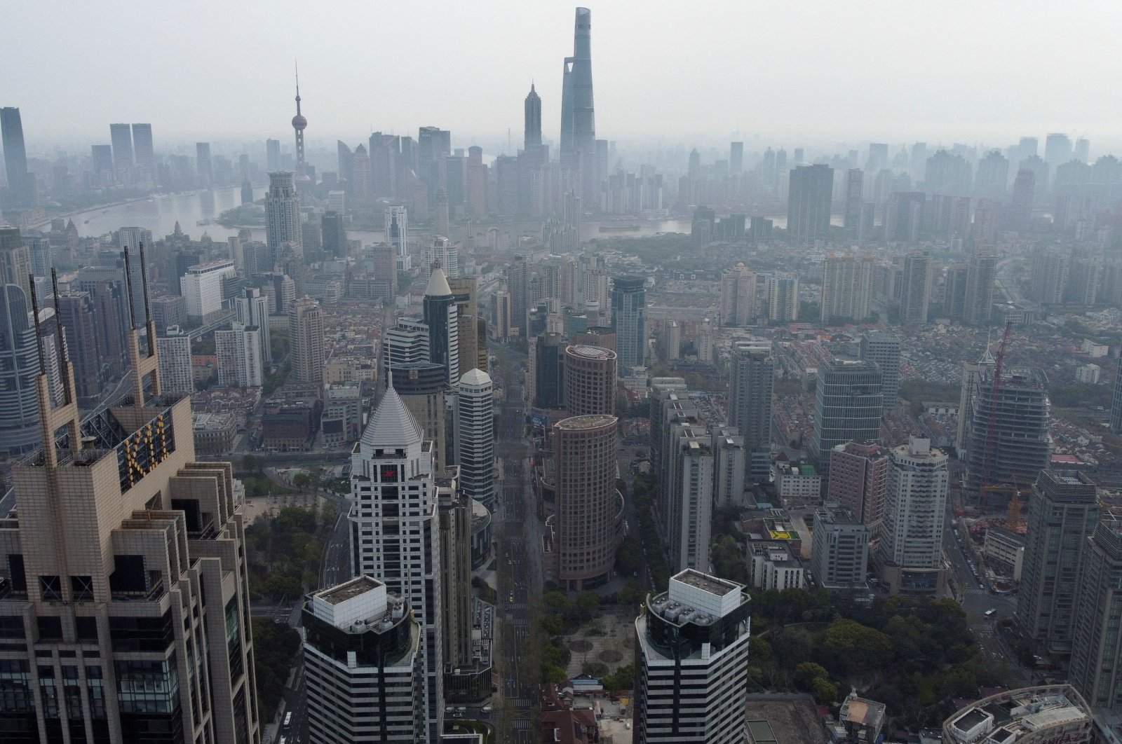 An aerial view shows the Lujiazui financial district and other buildings along the Huangpu river amid a lockdown to contain the coronavirus spread in Shanghai, China, March 30, 2022. (Reuters Photo)