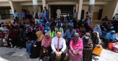 Turkey Diyanet Foundation officials and Ankara's Ambassador to Khartoum Irfan Neziroğlu (C) delivered food boxes to families in need, Khartoum, Sudan, March 31, 2022. (AA Photo)