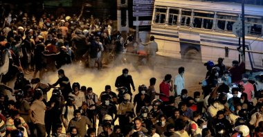Demonstrators move away from tear gas used by the police near Sri Lankan President Gotabaya Rajapaksa's residence during a protest against him, Colombo, Sri Lanka, March 31, 2022. (Reuters Photo)