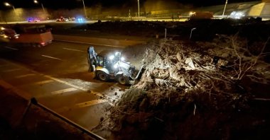 An earth mover works on the Istanbul-Ankara Motorway to remove dirt, rocks and debris after a landslide near the Mount Bolu Tunnel, in Düzce, northwestern Turkey, April 2, 2022. (AA Photo)