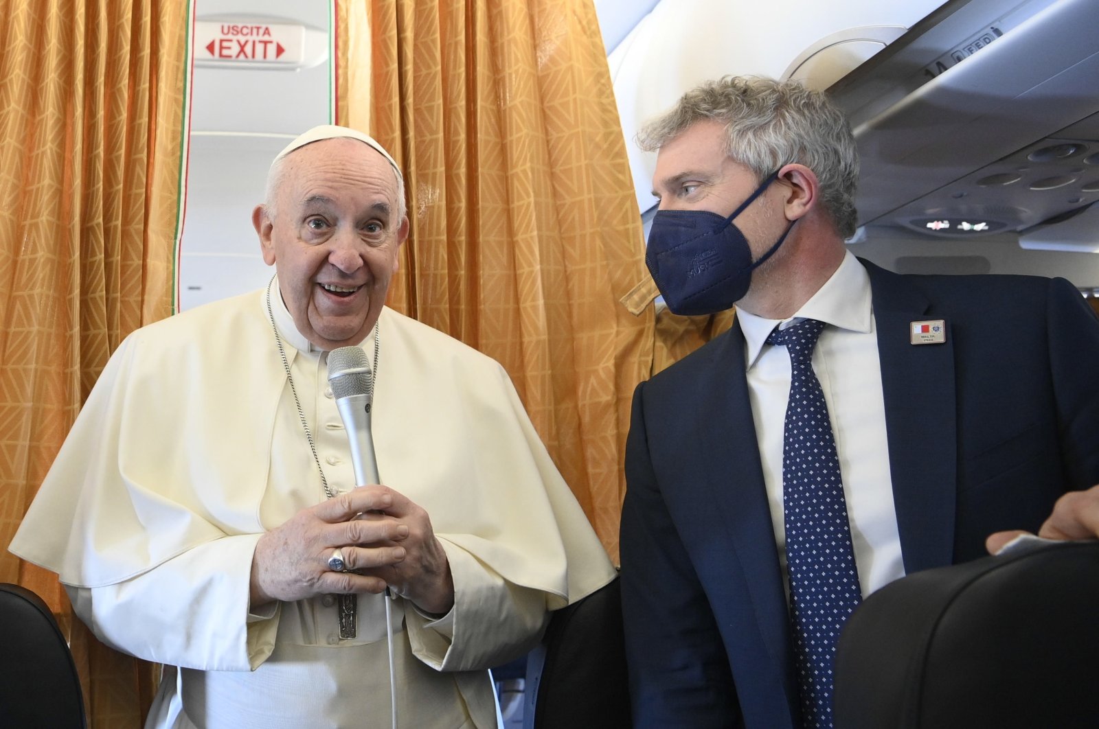 A handout provided by the Vatican Media shows Pope Francis standing aboard the plane on his way to Malta International Airport, ahead of his apostolic visit in Luqa, Malta, April 2, 2022. (EPA Photo)