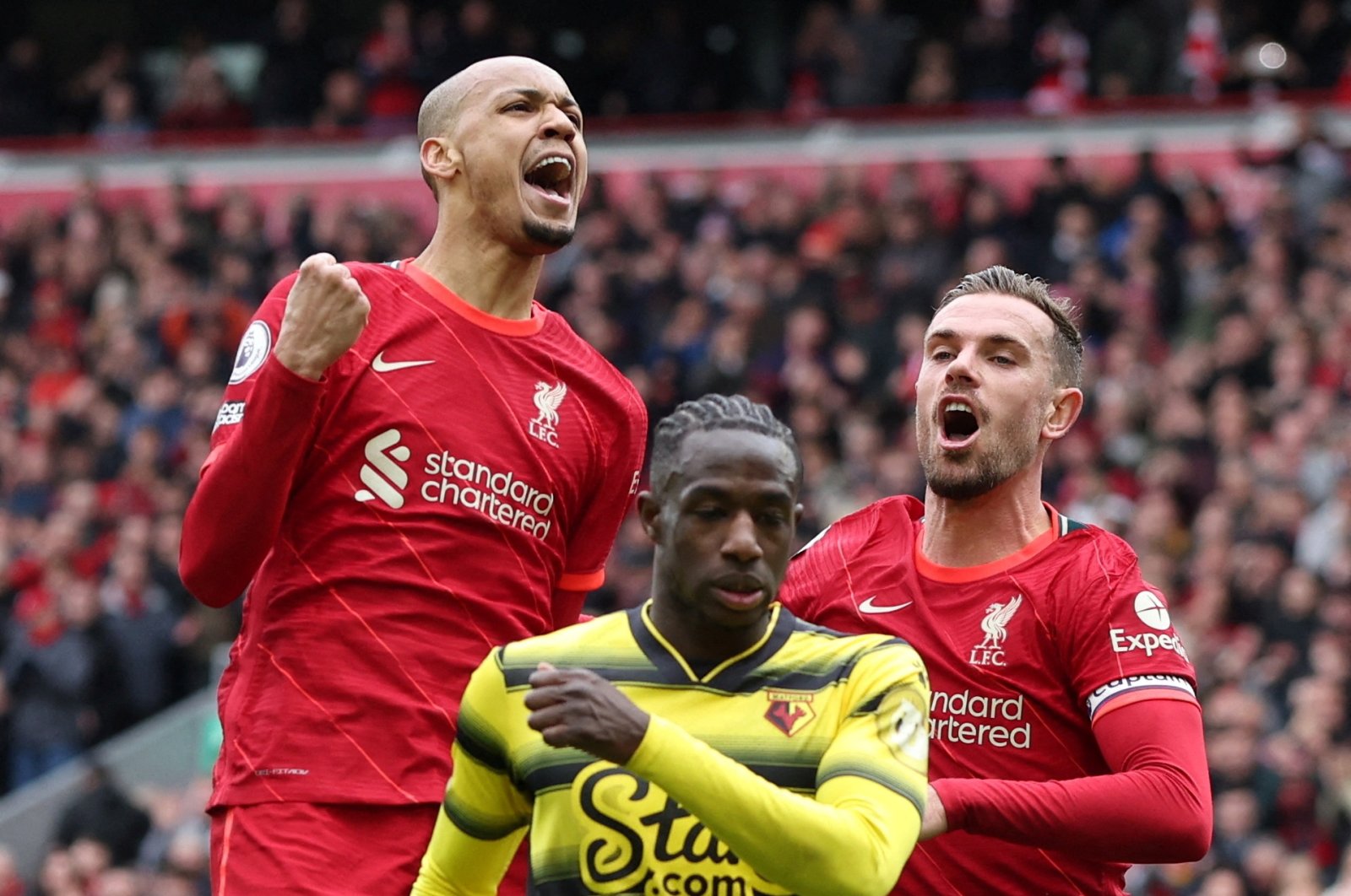 Liverpool&#039;s Fabinho celebrates scoring his team&#039;s second goal with Jordan Henderson during a Premier League match against Watford, at Anfield Stadium, in Liverpool, U.K., April 2, 2022. (Reuters Photo)