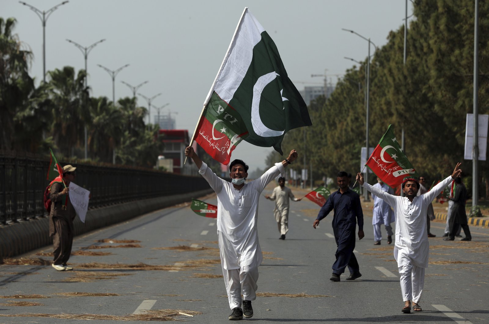 Supporters of ruling party Pakistan Tehreek-e-Insaf (PTI) chant slogans during a protest in Islamabad, Pakistan, April 3, 2022. (AP Photo)