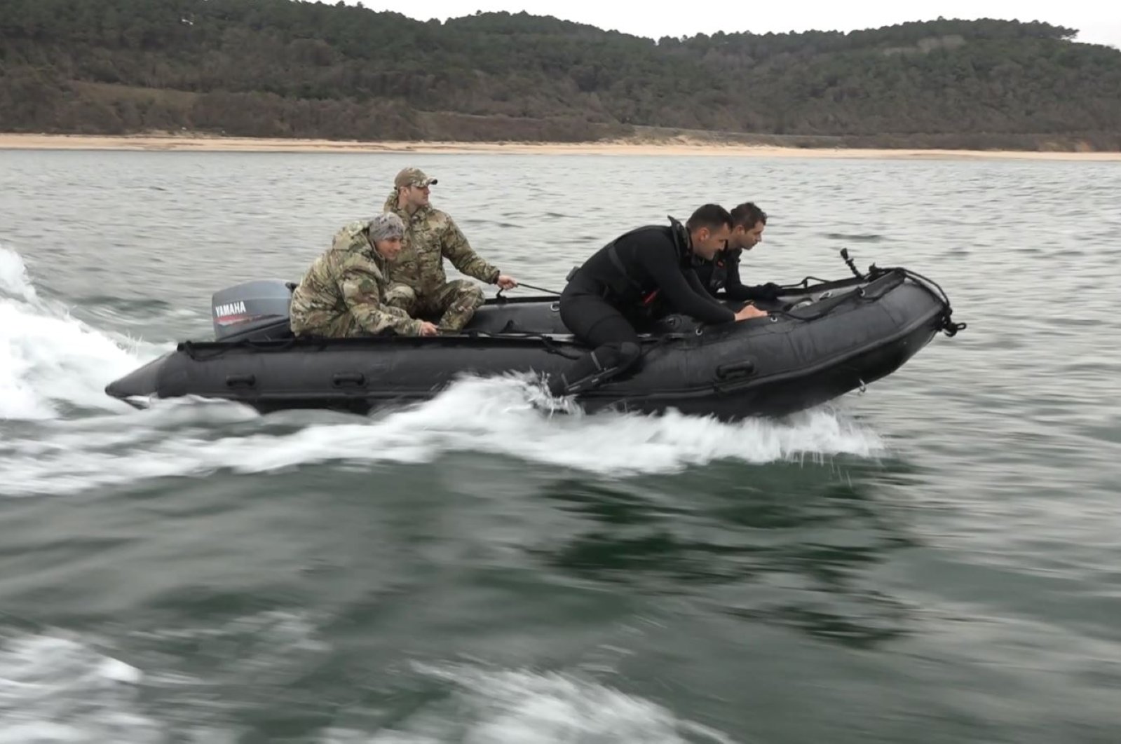 Turkish naval personnel are seen on a boat during mine removal efforts, April 3, 2022. (DHA Photo)