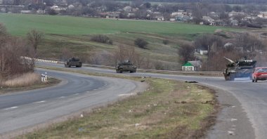 A view shows an armored convoy of pro-Russian troops during the Ukraine-Russia conflict on a road near the southern port city of Mariupol, Ukraine, April 3, 2022. (Reuters Photo)
