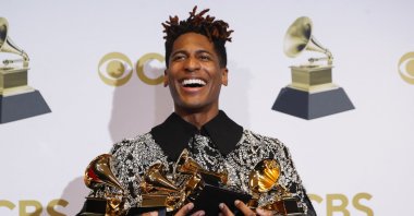 Jon Batiste poses with their Grammys for Best American Roots Performance for "Cry," album of the year for "We Are,” Best American roots song, best music video and best score soundtrack for visual media for "Soul," at the 64th Annual Grammy Awards at the MGM Grand Garden Arena in Las Vegas, Nevada, U.S., April 3, 2022. (REUTERS)
