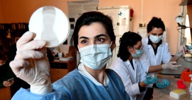 Researchers work in a laboratory of the Eliava Institute of Bacteriophages in Tbilisi, Georgia, Feb. 24, 2022. (AFP Photo)