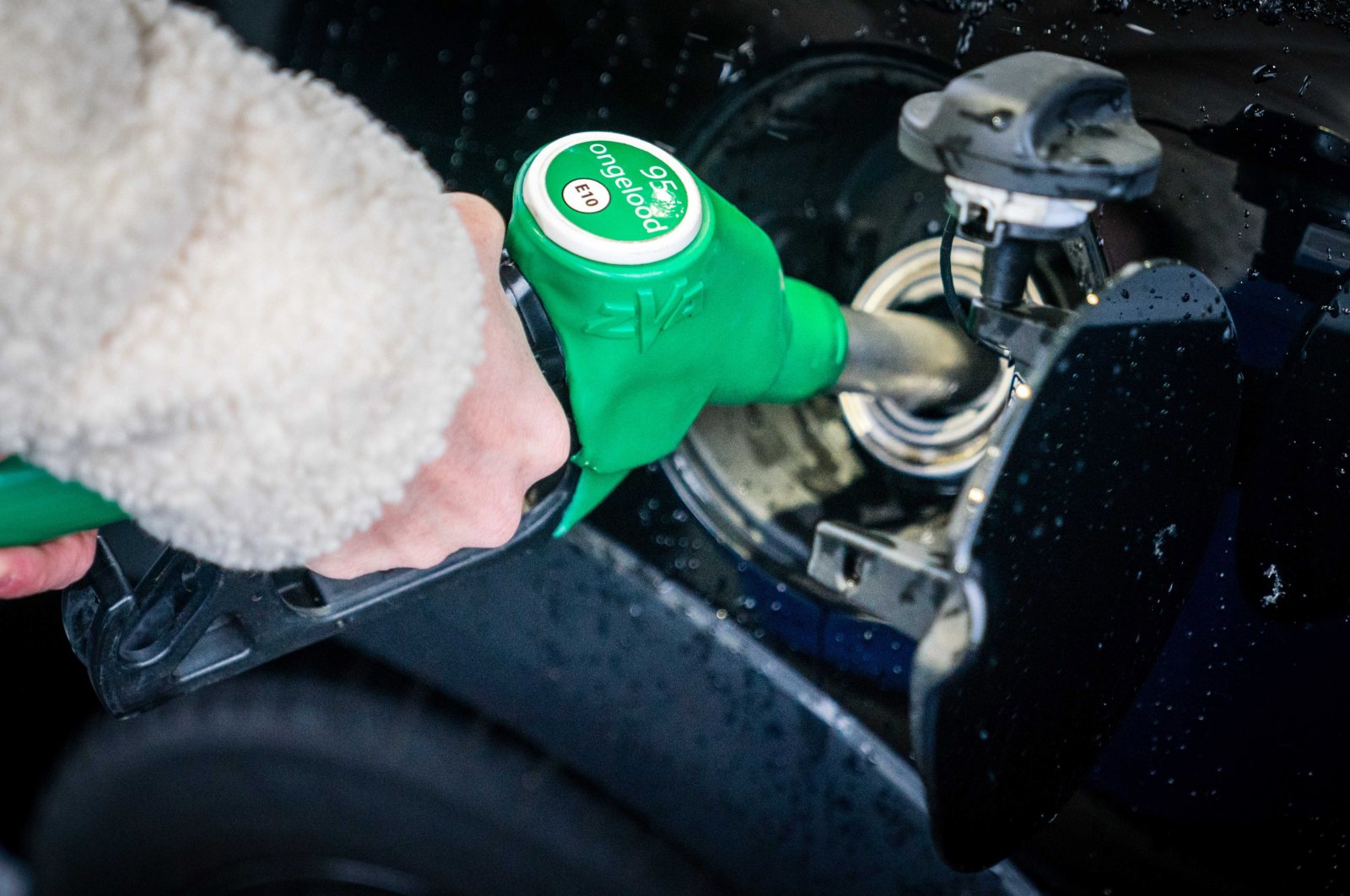 A person refuels at a Tango gas station in Mierlo, the Netherlands, April 1, 2022. (EPA Photo)