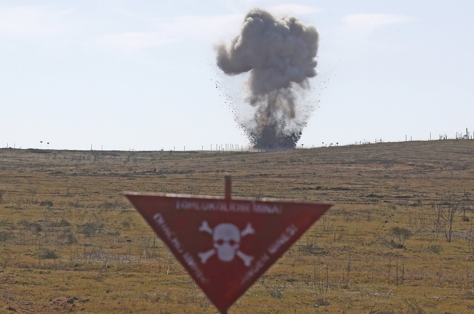 Unexploded ammunition is detonated during a demo mine-clearing operation by the Azerbaijan National Agency for Mine Action (ANAMA) to further operations to clear mines previously planted by Armenian forces, Fuzuli, Azerbaijan, Feb. 27, 2021. (Photo by Getty Images)
