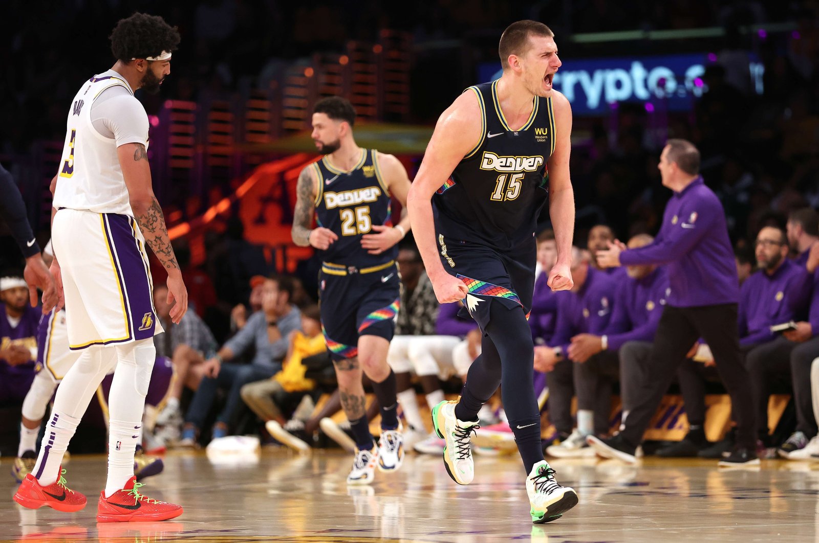 Denver Nuggets&#039; Nikola Jokic (R) reacts during an NBA match against the Lakers, Los Angeles, California, U.S., April 03, 2022. (AFP Photo)