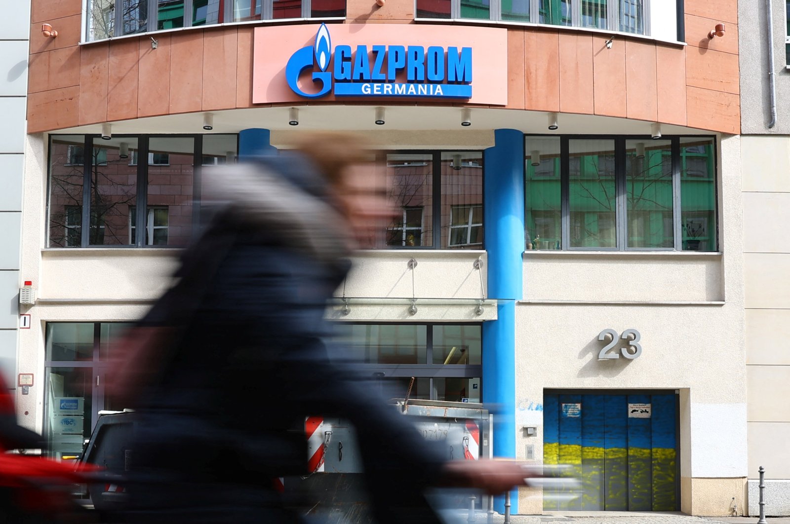 A cyclist passes the headquarters of Gazprom Germania, in Berlin, Germany, April 1, 2022. (Reuters Photo)