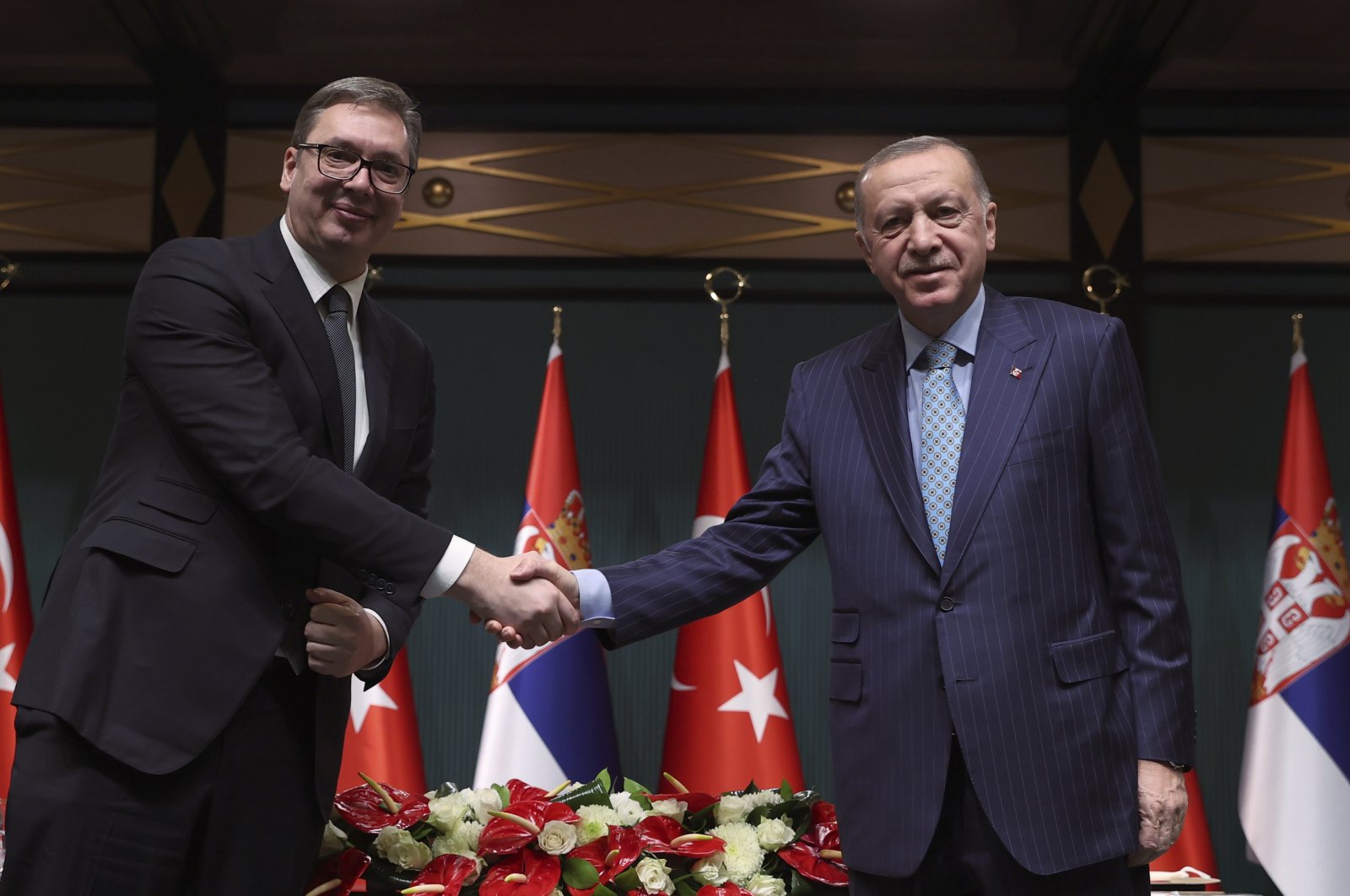 President Recep Tayyip Erdoğan (R) and Serbia&#039;s President Aleksandar Vucic shake hands after a joint press conference, in Ankara, Turkey, Jan. 18, 2022. (AP Photo)