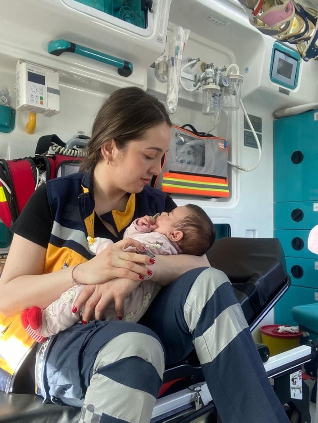 Emergency medical technician Büşra Durmaz holds the rescued baby she breastfed, Istanbul, Turkey, April 2, 2022. (IHA PHOTO)