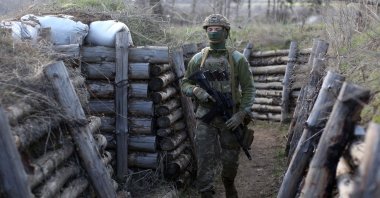 A Ukrainian soldier patrols along a trench in Schastya, Lugansk region, near the front line with Russia backed separatists, April 16, 2021. (AFP Photo)