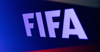 The FIFA logo is seen in front of the Russian flag in this illustration, Feb. 28, 2022. (Reuters Photo)