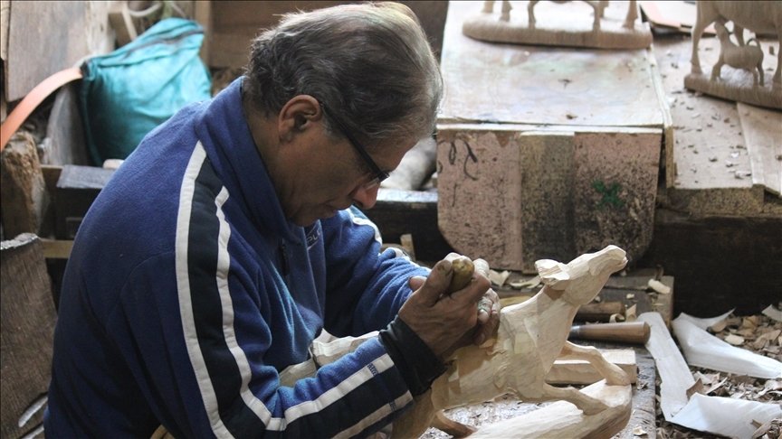 Mohammad Yusuf Muran works in his workshop, Srinagar, Kashmir, April 5, 2022. (AA)