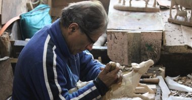 Mohammad Yusuf Muran works in his workshop, Srinagar, Kashmir, April 5, 2022. (AA)