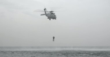 A Turkish military helicopter is seen during mine removal efforts, April 3, 2022 (DHA Photo)