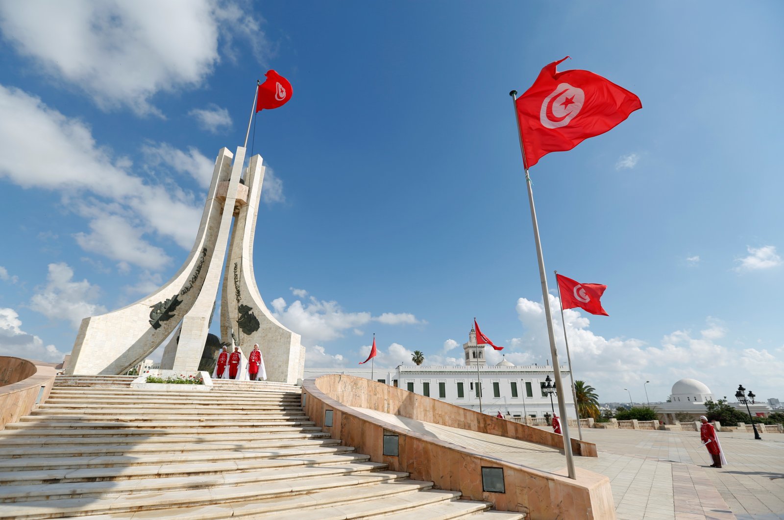 Members of the honor guard stand at attention during a flag-raising in place of Kasba in Tunis, Tunisia, June 26, 2018. (Reuters File Photo)
