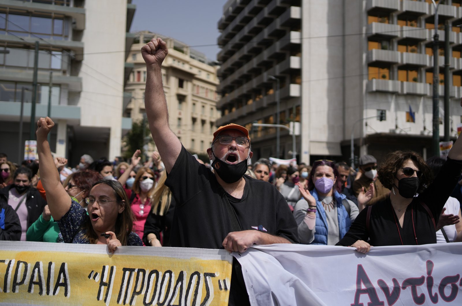 Demonstrators shout slogans as they march during a 24-hour nationwide strike in central Athens, Greece, April 6, 2022. (AP Photo)