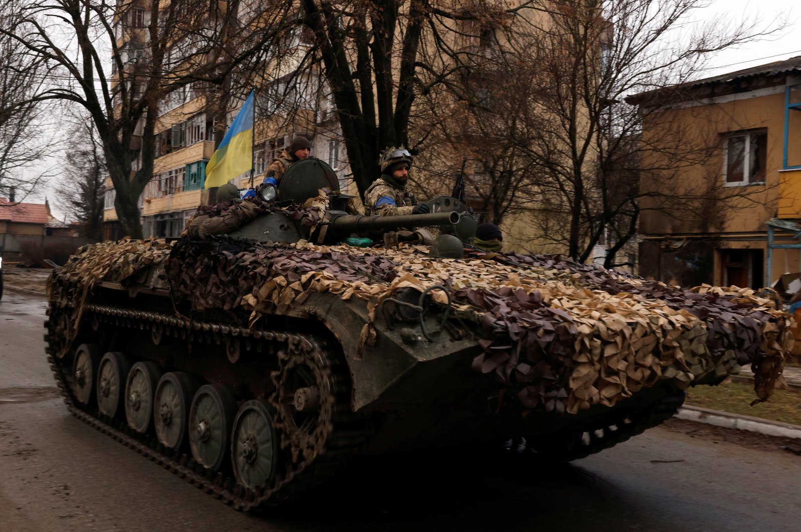 Ukrainian soldiers are pictured on their military vehicle, amid Russia&#039;s invasion of Ukraine in Bucha, in the Kyiv region, Ukraine, April 2, 2022. (Reuters Photo)