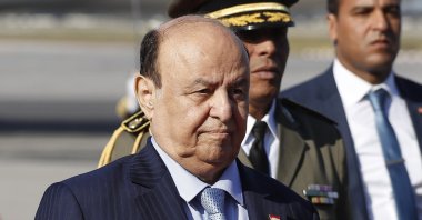Yemen&#039;s President Abed Rabbo Mansour Hadi walks next of his Tunisian counterpart Beji Caid Essebsi, not in photo, upon his arrival at Tunis-Carthage international airport to attend the Arab Summit, in Tunis, Tunisia, March 30, 2019. (AP Photo)