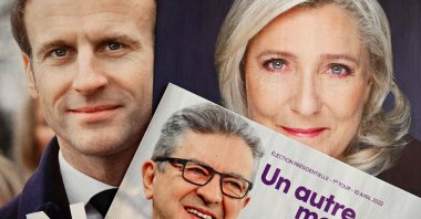 The folded electoral leaflets of French President Emmanuel Macron's La Republique en Marche party (L), La France Insoumise party's presidential candidate Jean-Luc Melenchon (C) and far-right Rassemblement National candidate Marine Le Pen ahead of the first round of the French presidential election, Marseille, southern France, April 6, 2022.