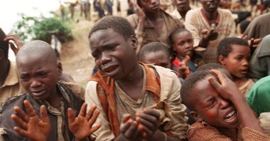 Rwandan refugee children plead with Zairian soldiers to let them cross a bridge to rejoin their mothers who had crossed the bridge moments before the soldiers closed the border Aug. 20, 1994 in  Bukavu, Zaire. For years, majority Hutus and minority Tutsis lived peaceably, side by side, only to explode in homicidal violence in which 500,000 people, most of them Tutsi, were massacred.  Millions of other Rwandans fled as refugees. (AP Photo)