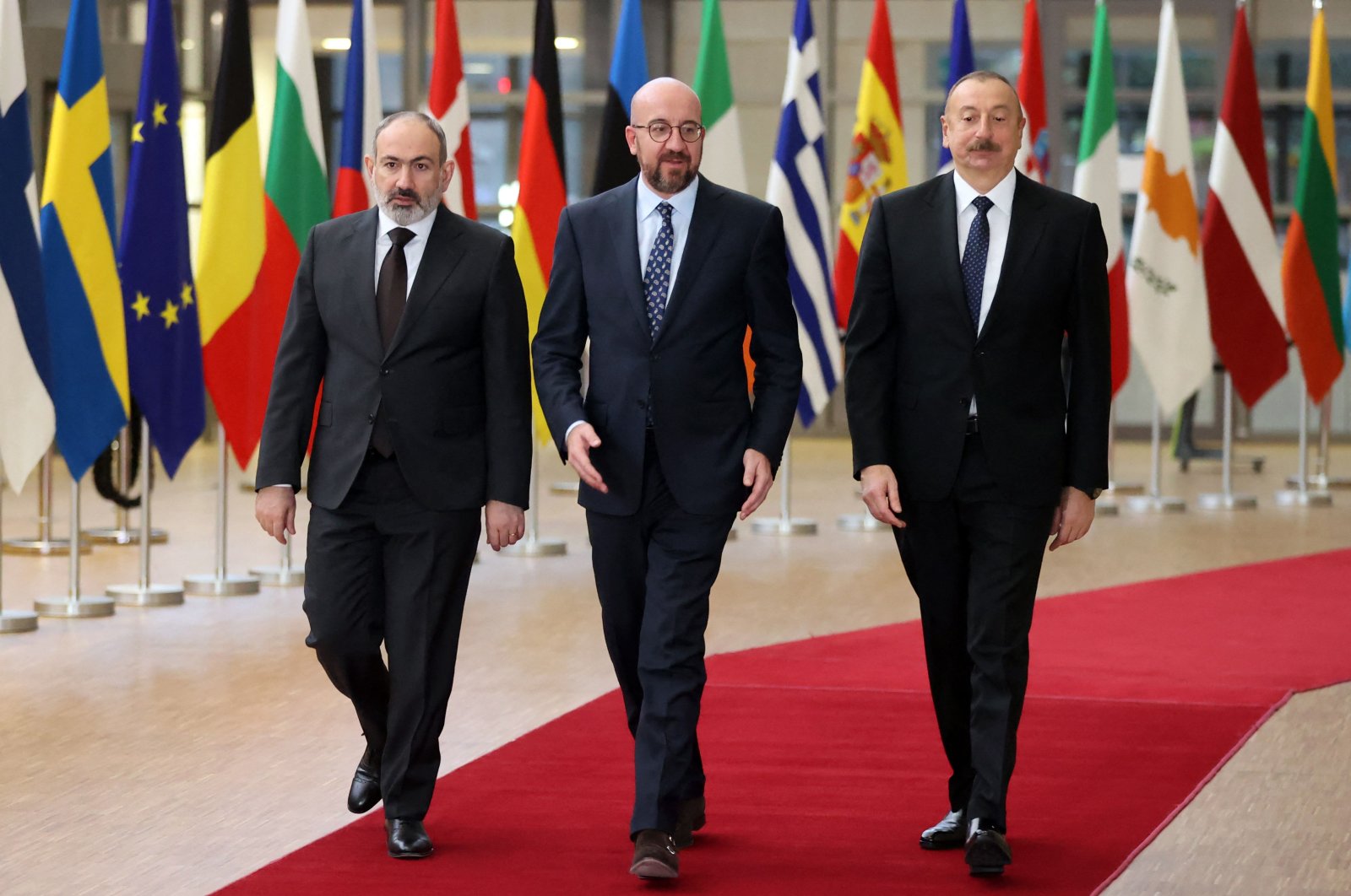 From left to right: Armenian Prime Minister Nikol Pashinian, President of the European Council Charles Michel and Azerbaijan&#039;s President Ilham Aliyev, arrive for an official picture before their meeting at the European Council in Brussels on April 6, 2022. (AFP Photo)