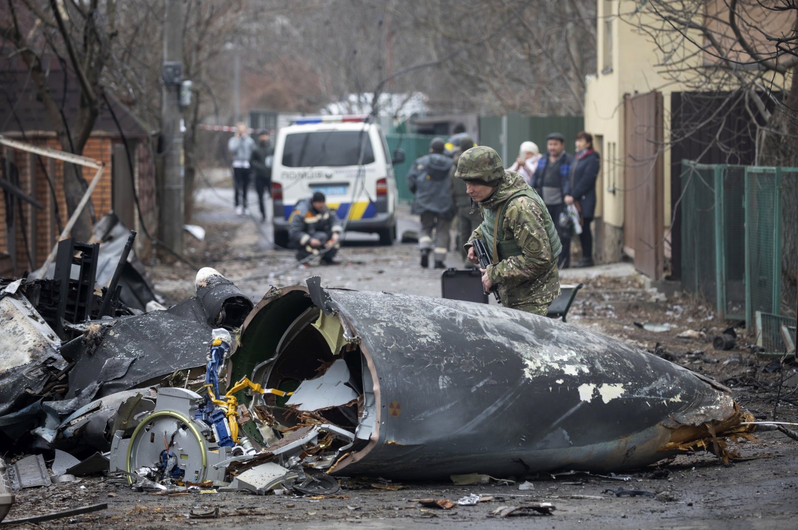 A Ukrainian soldier inspects fragments of a downed aircraft in Kyiv, Ukraine, Feb. 25, 2022.  (AP Photo)