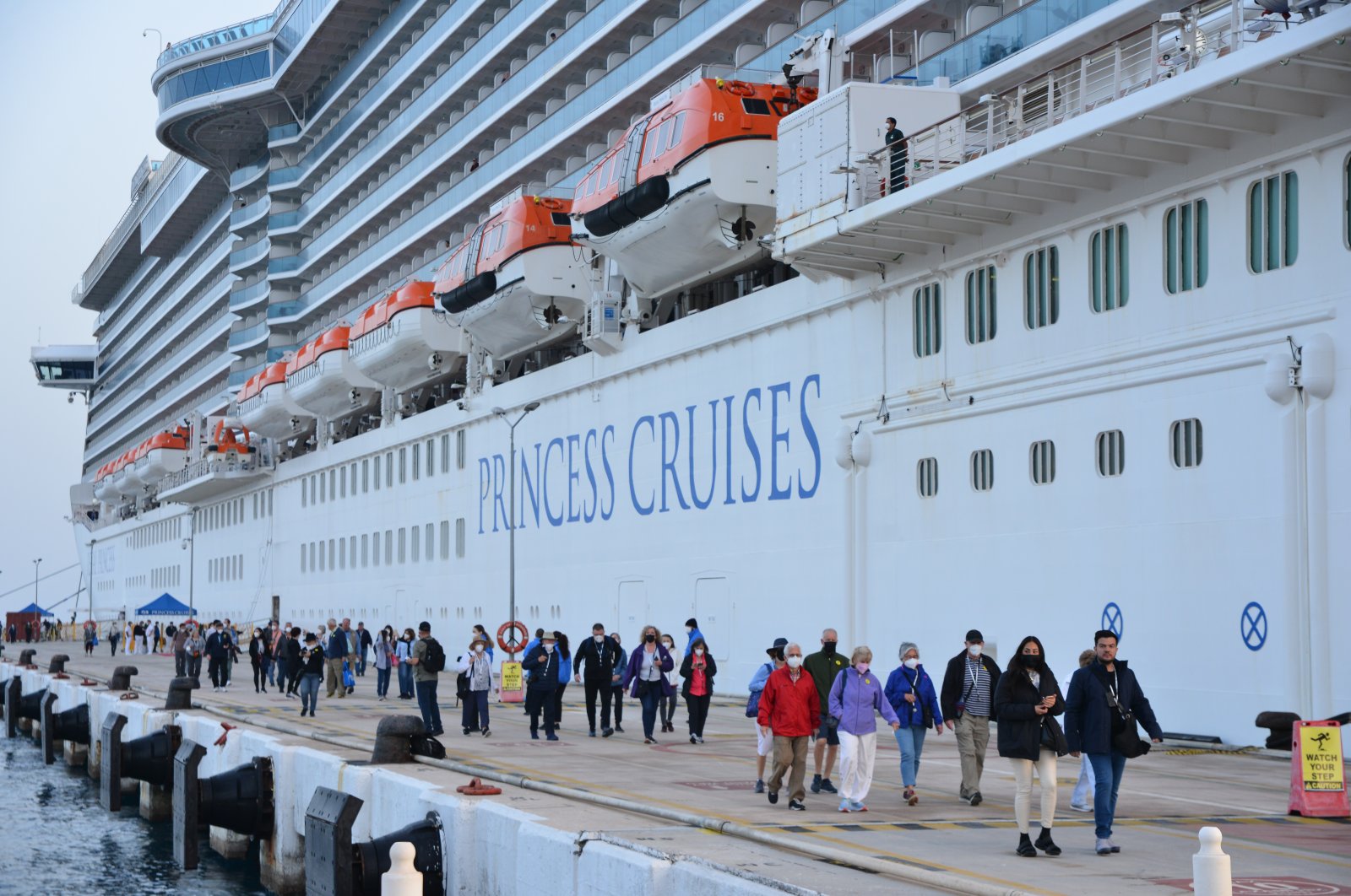 Tourists disembark from the Regal Princess cruise ship docked at Ege Port in Kuşadası in Aydın province, southwestern Turkey, April 6, 2022. (AA Photo)
