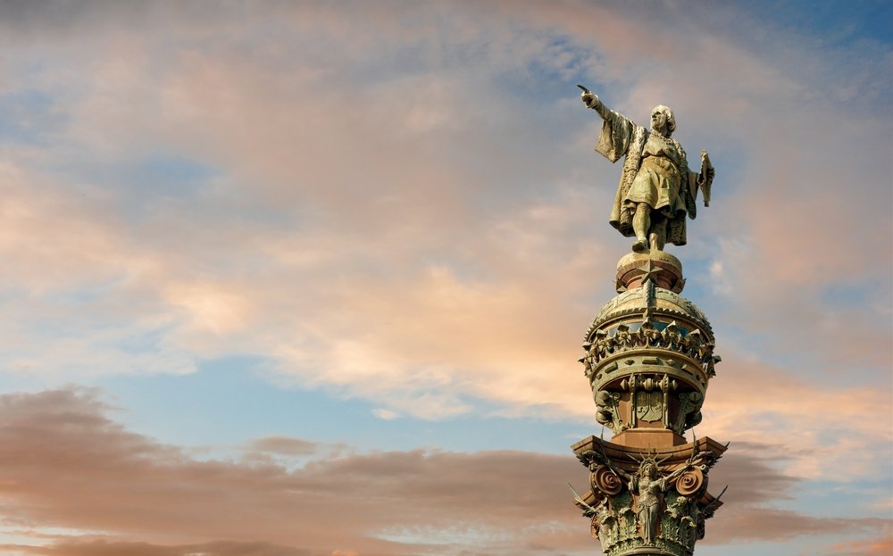 A monument of Christopher Columbus pointing toward America during golden sunset in La Rambla, Barcelona, Spain. (Shutterstock Photo)