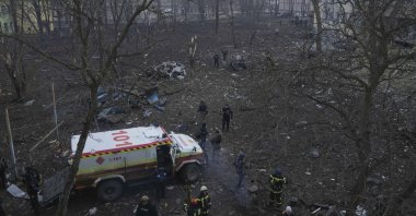 Ukrainian emergency employees work outside a maternity hospital damaged by shelling in Mariupol, Ukraine, March 9, 2022. (AP Photo)