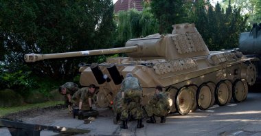 A World War II-era Panther tank is prepared for transportation from a residential property in Heikendorf, northern Germany, July 2, 2015. (AP Photo)