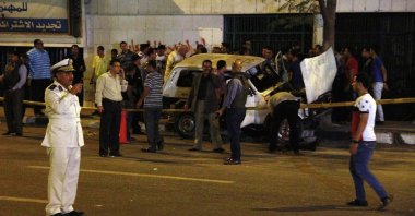 Egypt's security forces cordon off an area after a vehicle explored in Cairo's Ramses district, Egypt, late Friday, May 2, 2014. (AP Photo)