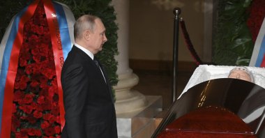 Russian President Vladimir Putin stands by the coffin of Russian Liberal Democratic Party leader Vladimir Zhirinovsky during a farewell ceremony in Moscow, Russia, April 8, 2022. (AP Photo)
