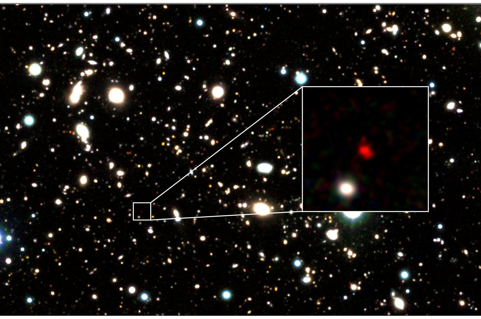 The distant early galaxy HD1, object in red, is shown at the center of this undated zoom-in handout image. (Reuters Photo)
