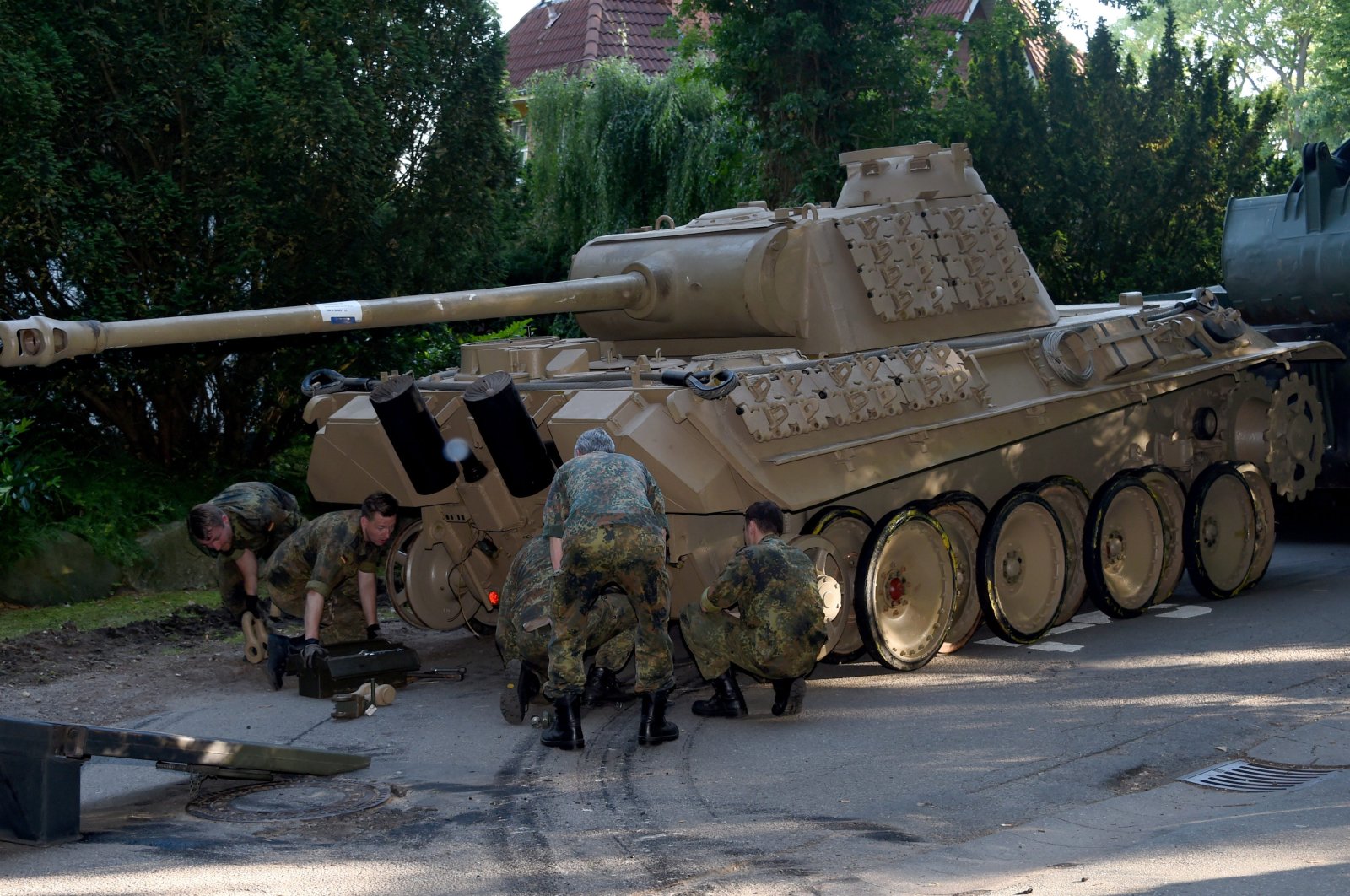 A World War II-era Panther tank is prepared for transportation from a residential property in Heikendorf, northern Germany, July 2, 2015. (AP Photo)