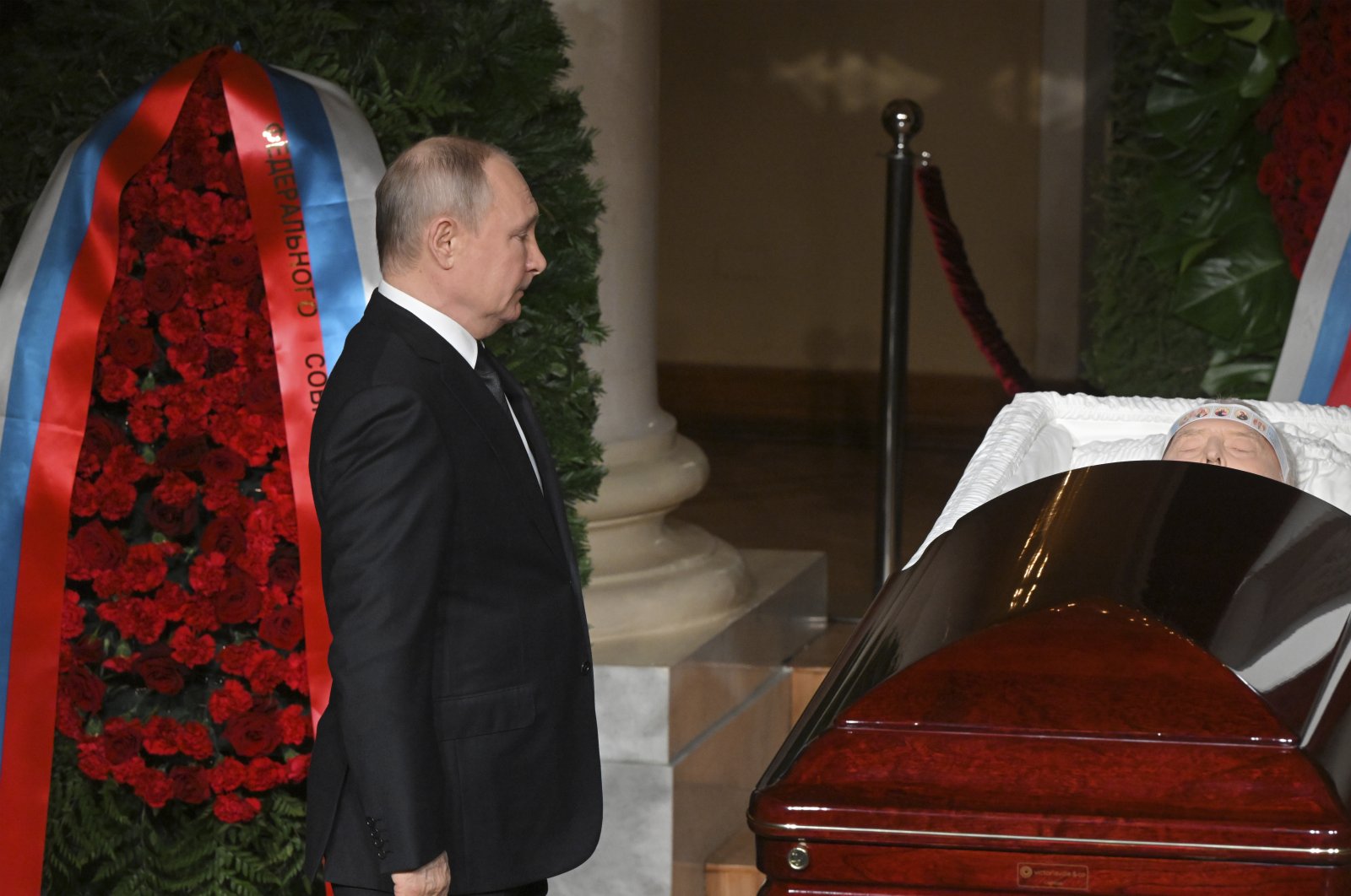 Russian President Vladimir Putin stands by the coffin of Russian Liberal Democratic Party leader Vladimir Zhirinovsky during a farewell ceremony in Moscow, Russia, April 8, 2022. (AP Photo)