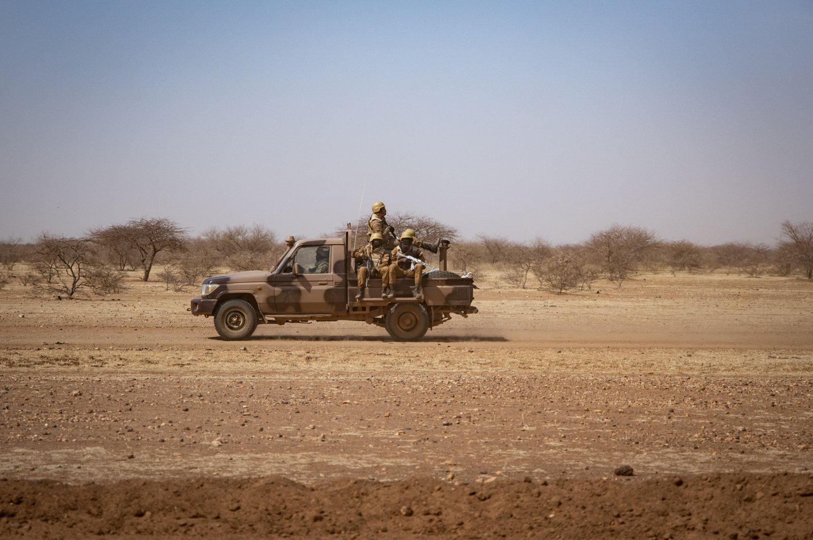 Burkina Faso soldiers patrol aboard a pick-up truck along the road from Dori to the Goudebo refugee camp, Burkina Faso, Feb. 3, 2020. (AFP File Photo)