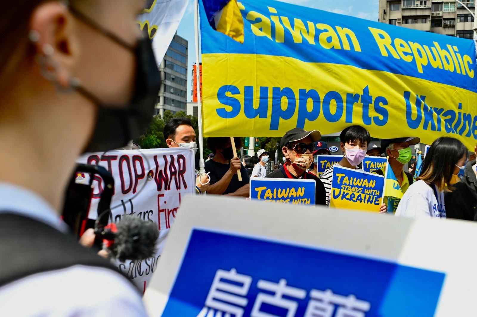 Taiwanese march on the streets protesting the war in Ukraine during a rally in Taipei, Taiwan, March 13, 2022. (AFP Photo)