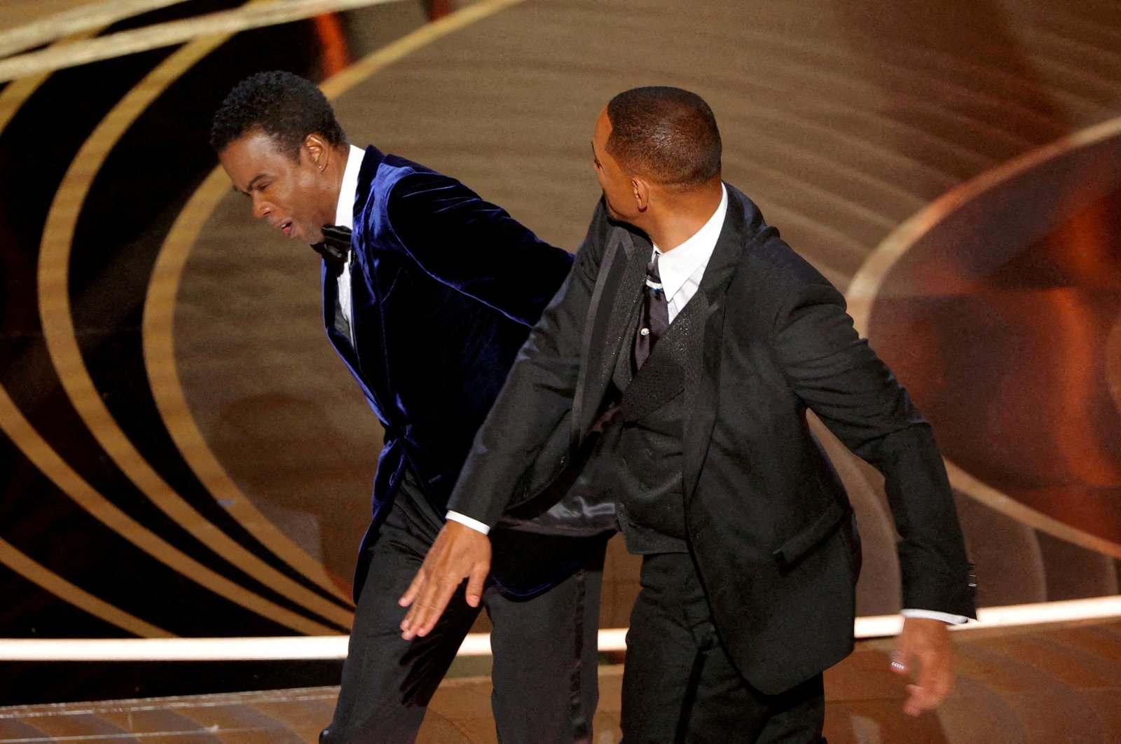 Will Smith (R) slaps Chris Rock as Rock spoke on stage during the 94th Academy Awards in Hollywood, Los Angeles, California, U.S., March 27, 2022. (Reuters File Photo)