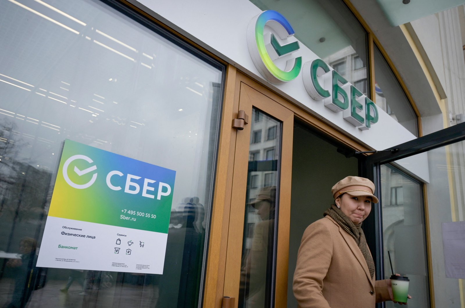 A woman leaves a branch of Russia&#039;s majority state-owned banking and financial services company Sberbank in Moscow, Russia, April 7, 2022. (AFP Photo)