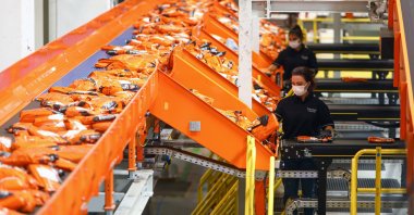 Trendyol workers are seen at the e-commerce company's transfer center in the Tuzla district of Istanbul, Turkey, Aug. 15, 2021. (AA Photo)